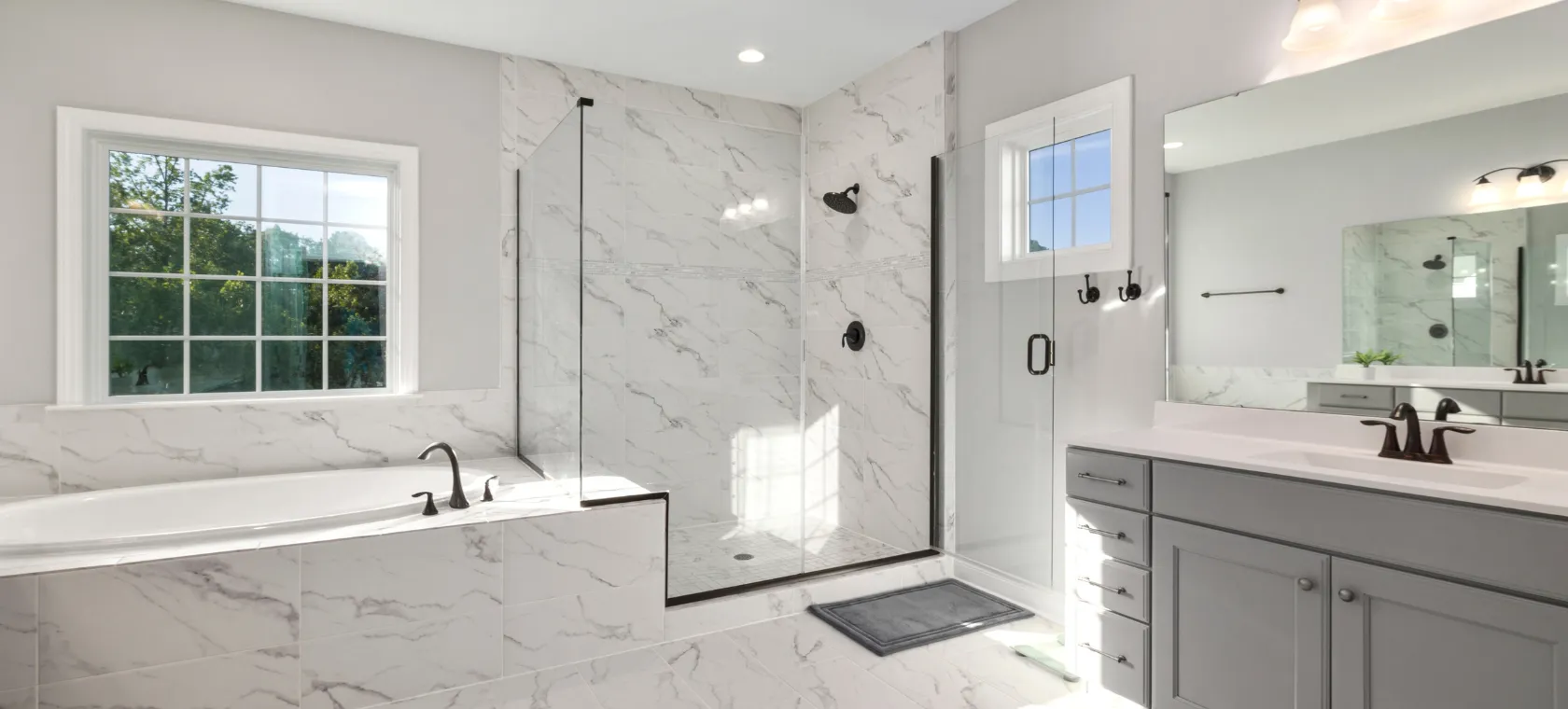 Bathroom remodeling Los Angeles modern bathroom with marble shower glass enclosure and upgraded vanity