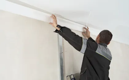 Interior remodeling contractor in Los Angeles CA installing ceiling trim and finishing work